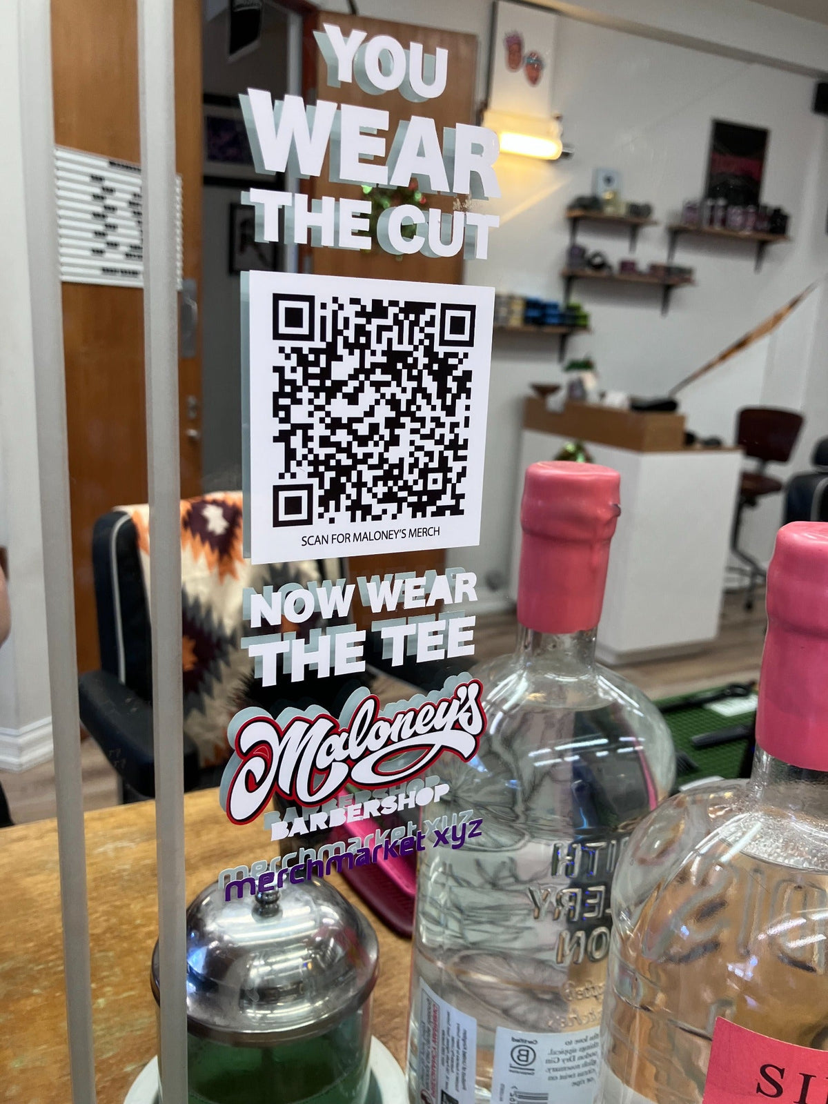 Maloney's Barber Shop merch QR display