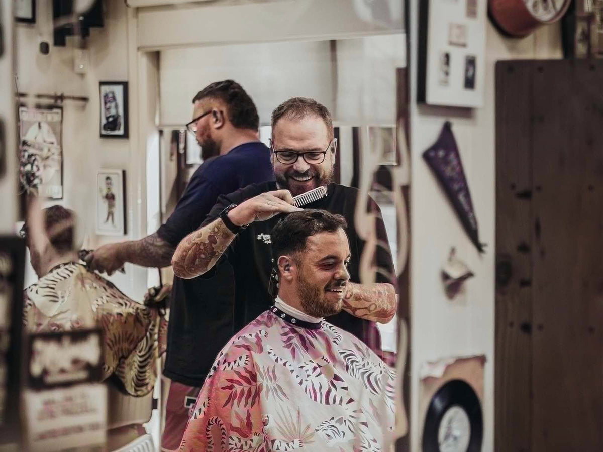 Maloney's Barber Shop barber with client
