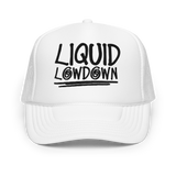 White foam trucker hat by Liquid Lowdown with front panel design, adjustable one-size fit, and mesh back for ventilation.