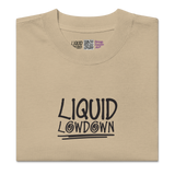 Unisex faded khaki Liquid Lowdown T-shirt with oversized fit, front view showing distressed, vintage-style design.